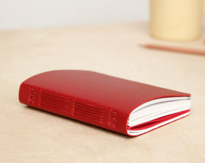 Small Hand-sewn Notebook with Assorted Papers