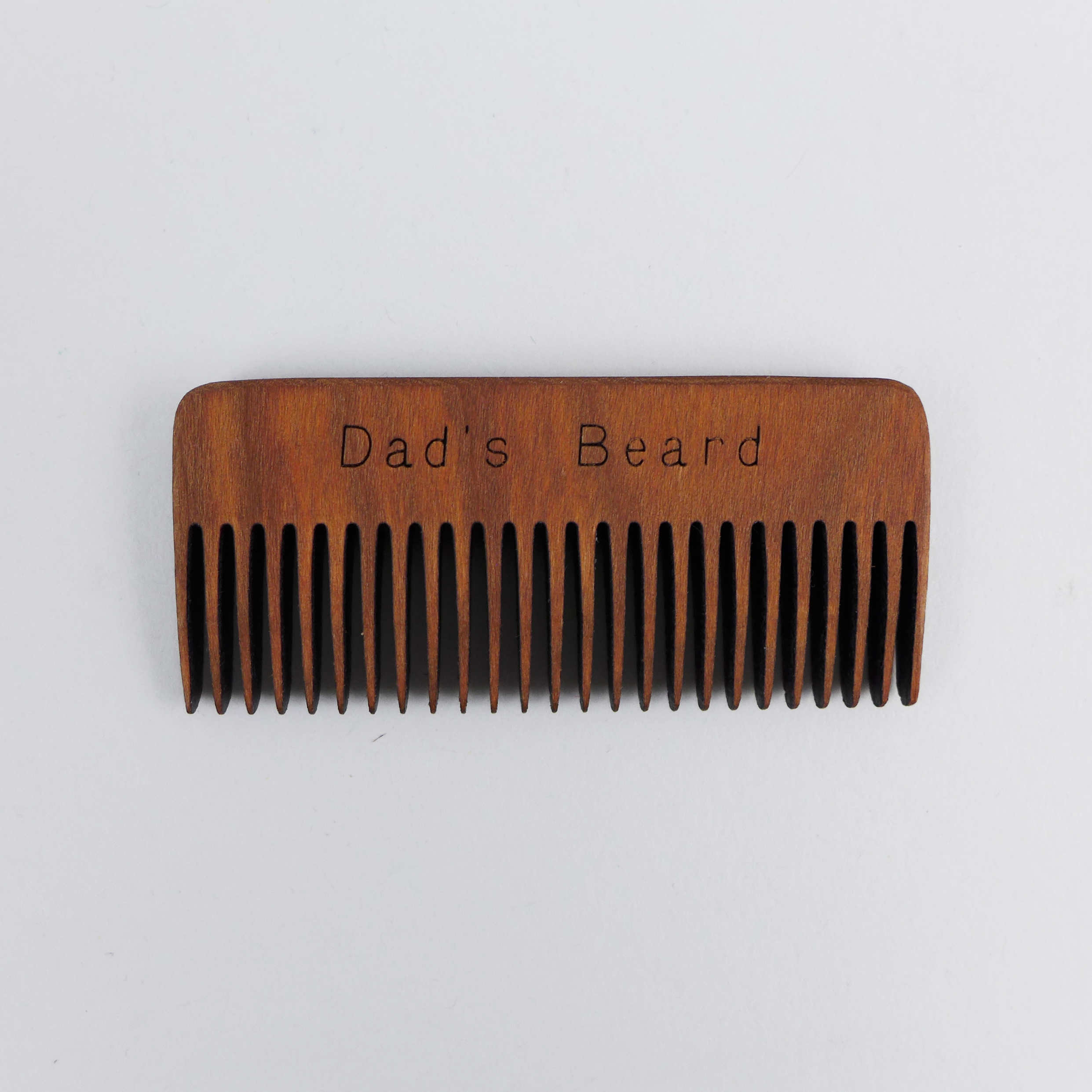 Beard comb is made out of solid cherry wood by Hannah’s Ideas in Wood at the Center for Art in Wood