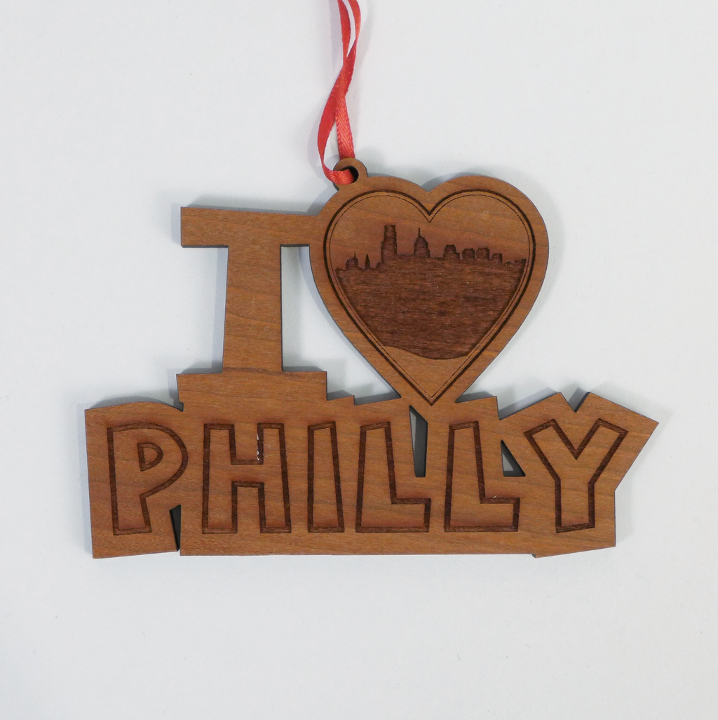 Custom laser cut wood ornaments by Nestled Pines at the Center for Art in Wood