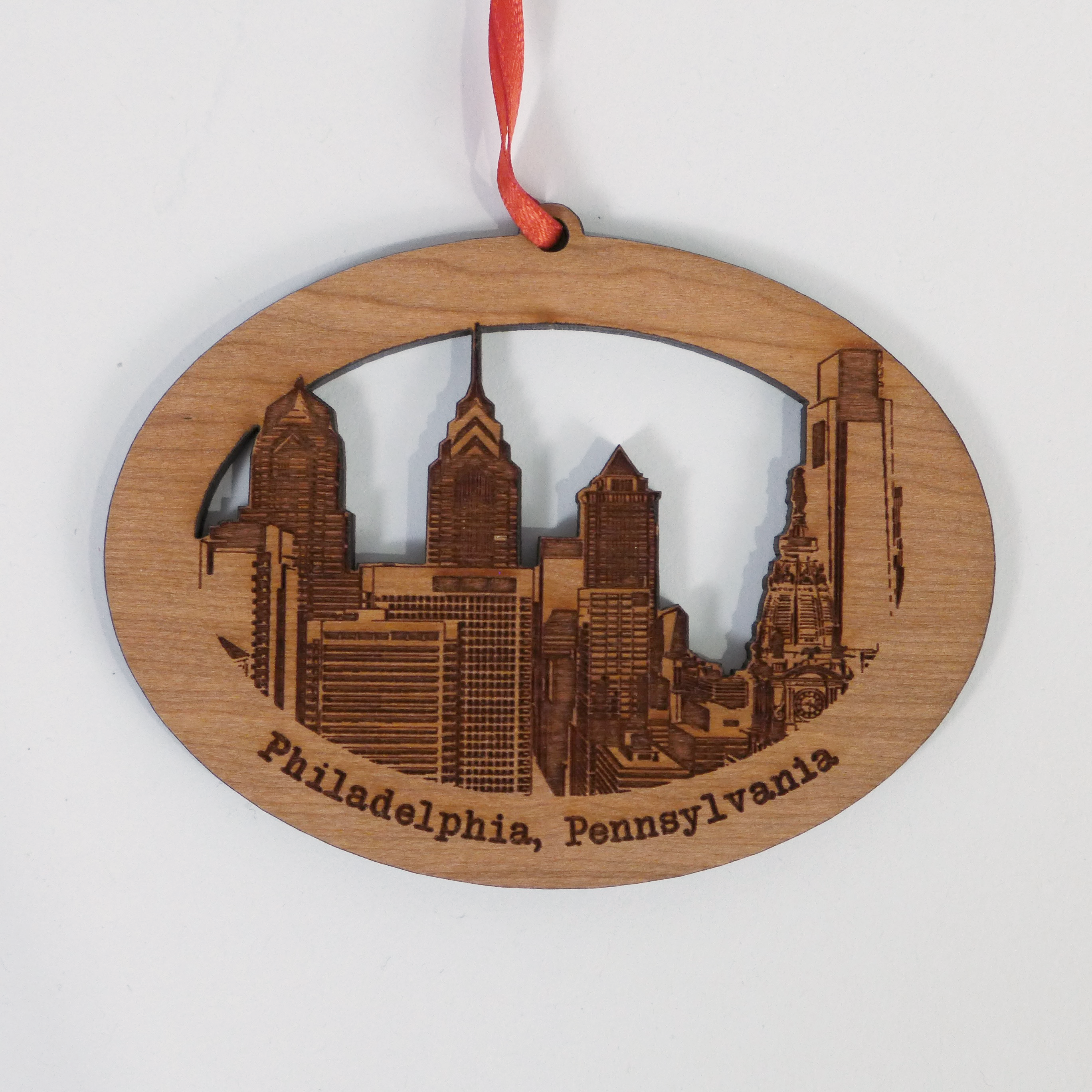 Custom laser cut wood ornaments by Nestled Pines at the Center for Art in Wood