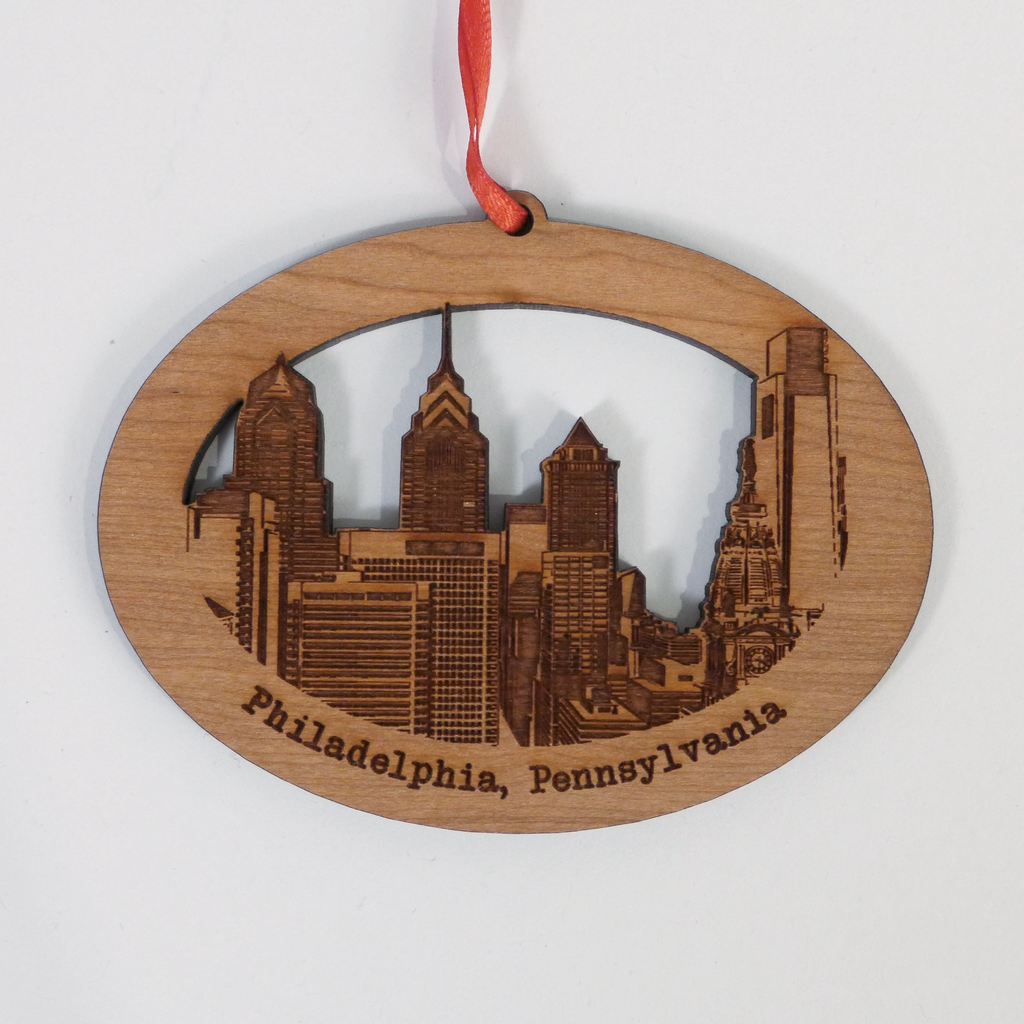 Custom laser cut wood ornaments by Nestled Pines at the Center for Art in Wood